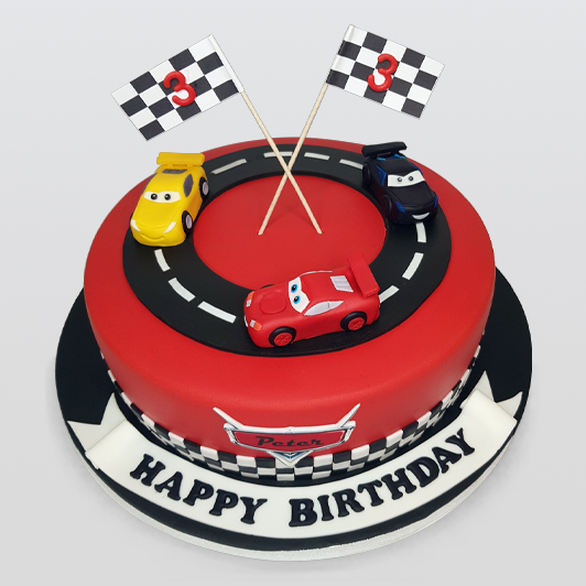 Cars racing birthday cake